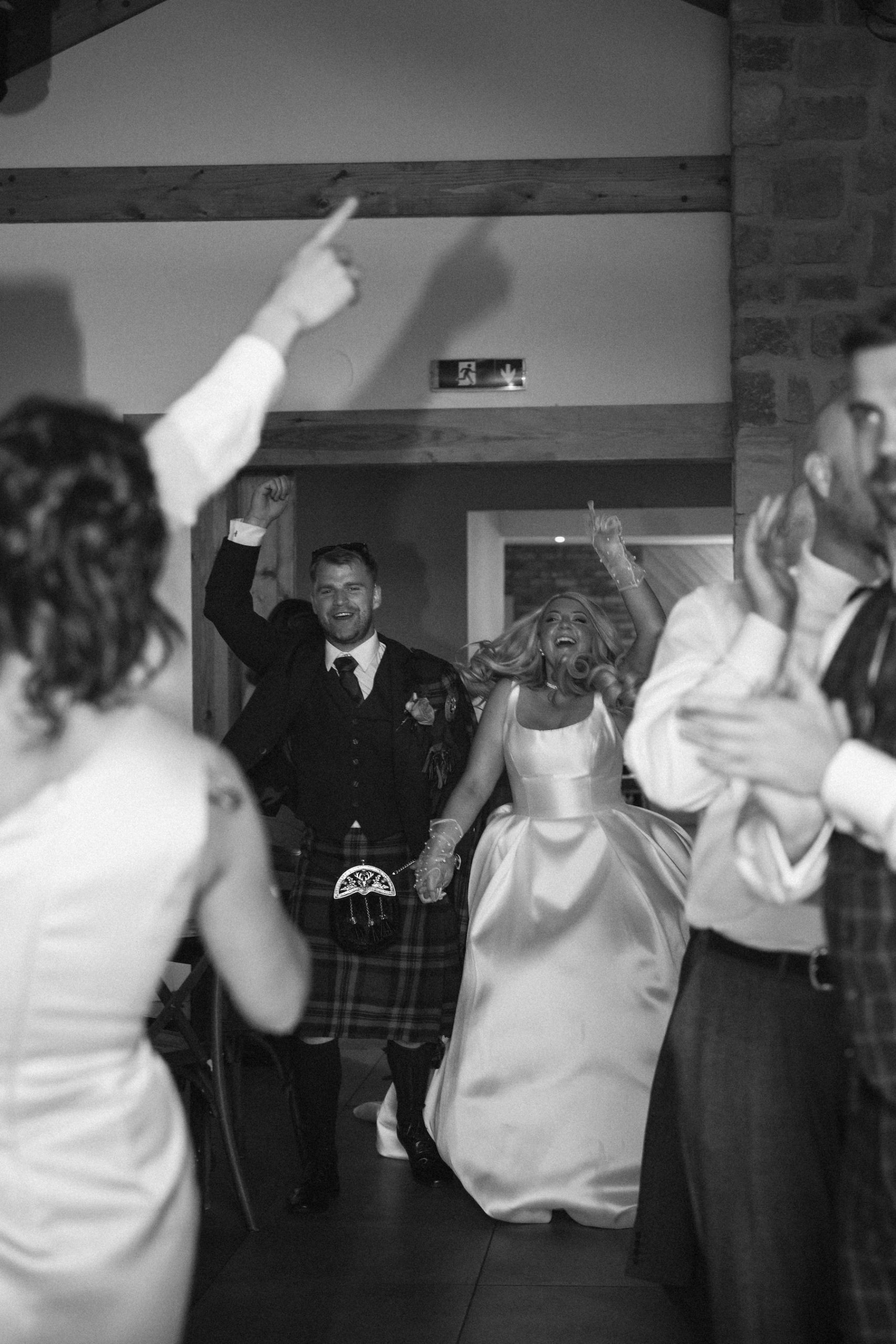 CARLY + NATHAN Couple entering evening reception